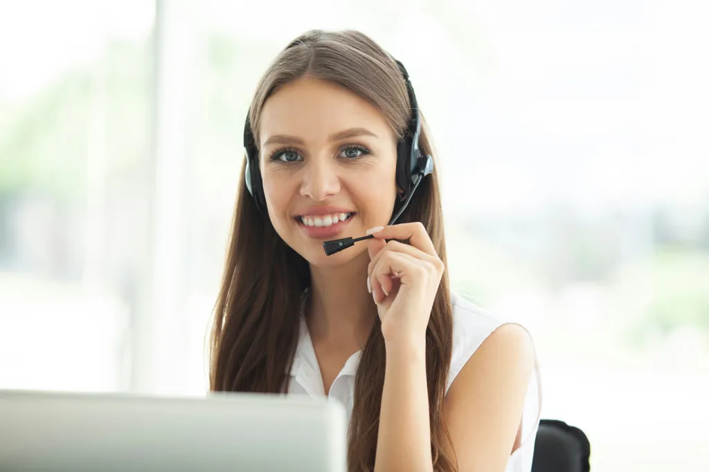 Hospitality reservations agent smiling on a guest call