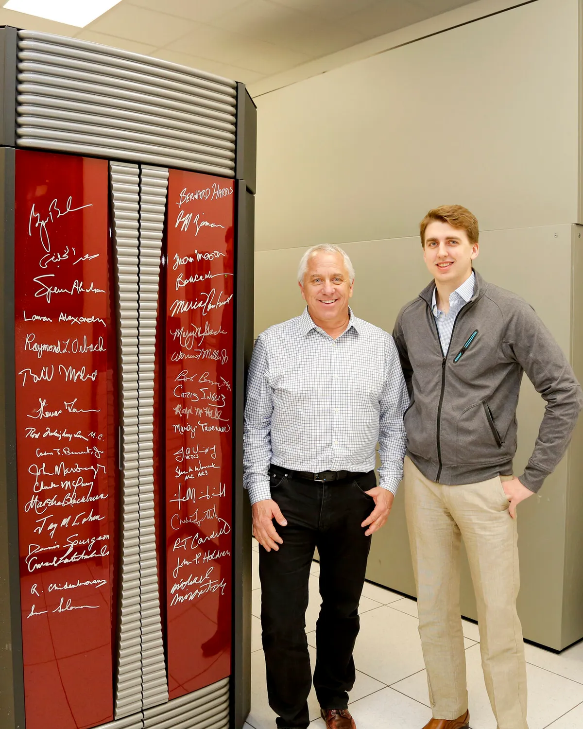 Greg LeMond and Nicolas Wegener beside the signed Cray X1E supercomputer at Oak Ridge National Laboratory